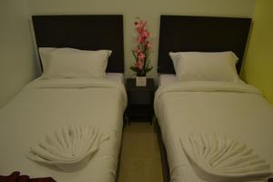 DR槟城酒店 客房内的一张或多张床位