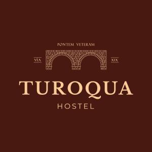 庞特维德拉Turoqua Hostel的砖桥酒店标志