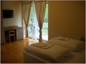 薰衣草庭式旅馆客房内的一张或多张床位