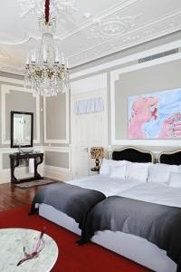 Palacete Chafariz Del Rei - by Unlock Hotels客房内的一张或多张床位