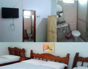 波多韦柳Engenheiros Hotel - Porto Velho的浴室设有两张床、一个水槽和镜子