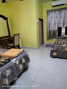 Hotel Murah Pasir Puteh客房内的一张或多张床位