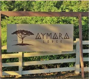 波科内Aymara Lodge的 ⁇ 上亚马逊小屋的标志