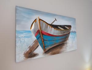 Livadi AstypalaiasGiasemi Room No 8 Folegandros的海滩上的一艘船的画