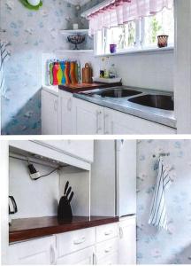 厄勒布鲁Eden (Natur & lugnet)的白色的厨房设有水槽和台面