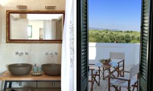 萨维勒特里Boutique Hotel Masseria Sottomasi的墙上设有桌子和镜子的房间