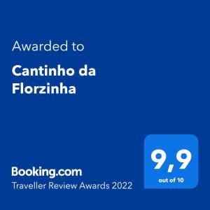 伊瓜苏Cantinho da Florzinha的手机的屏幕,手机的文本被授予canina da flore