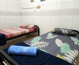 Tatai Kumang Homestay客房内的一张或多张床位