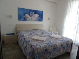 圣维托罗卡波Casa Diamante的一间卧室配有一张壁画床