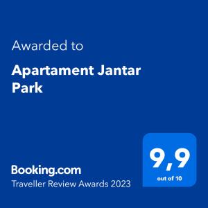 詹塔尔Apartament Jantar Park的标有协议门卫公园文本的蓝色标志