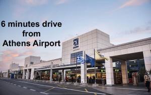 斯巴达Nesto Athens Airport的商店前方,距离雅典机场只有几分钟的车程