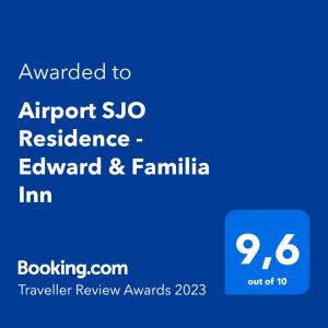 阿拉胡埃拉Airport SJO Residence - Edward & Familia Inn的蓝色的标语,写上写给机场的“无住所”和“家庭”的标语