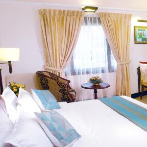 Hotel Grand Thekkady客房内的一张或多张床位