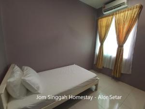 Jom Singgah Homestay - Alor Setar客房内的一张或多张床位