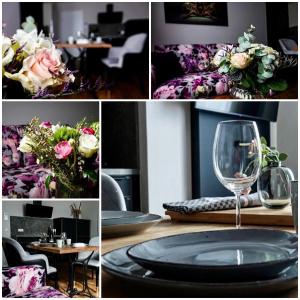 卢布明Residence Black Eagle Lubmin Strand的一张桌子上的照片和一杯葡萄酒