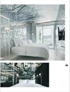 清迈Little Shelter Hotel Chiangmai SHA Plus的卧室配有白色的床和树壁画