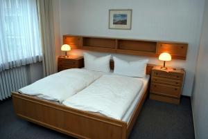 豪斯莫尔斯酒店客房内的一张或多张床位