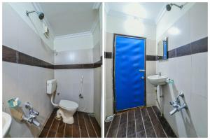 KhammamOYO Surya Teja Residency的一间带卫生间和蓝色门的浴室