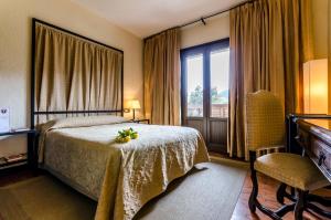Hotel Temple Ponferrada客房内的一张或多张床位