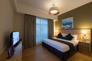 胡志明市萨默塞特酒店客房内的一张或多张床位