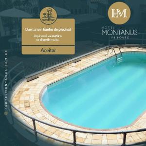 新弗里堡Hotel Montanus的一个带有阅读refermontus jaquetos aquarius标志的游泳池