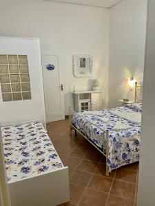 Ninni Mondello House客房内的一张或多张床位