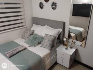 Apartamento sector exclusivo acogedor客房内的一张或多张床位