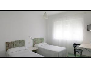 Hotel Langosteira客房内的一张或多张床位