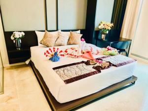 Tropicana The Residence KLCC Serviced Suites客房内的一张或多张床位