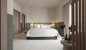 卡拉马塔Evripidou 7 - Kalamata Mediterranean Suites的卧室配有白色的床和镜子