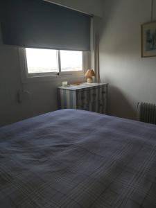 Apartamento con vistas al mar客房内的一张或多张床位