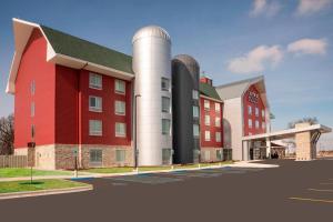 Fair OaksFairfield Inn & Suites by Marriott Fair Oaks Farms的红色建筑的 ⁇ 染