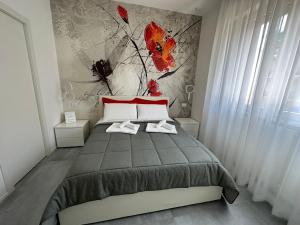 科尔西科B&B Prestige的一间卧室配有一张壁画床
