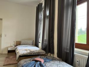 Kosta's Monteur- und Ferienwohnungen客房内的一张或多张床位
