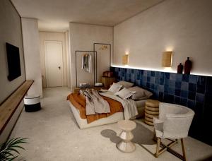 波罗斯Sirene Blue Luxury Beach Resort的卧室配有1张床、1张桌子和1把椅子