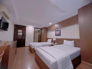 Nha Trang Crystal Hotel客房内的一张或多张床位