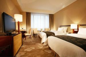 天津赛象酒店客房内的一张或多张床位