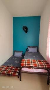 Homestay An-Nur Residensi Pendang客房内的一张或多张床位