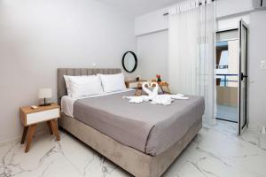 罗希姆诺Casa di Vila的一间卧室配有一张带两个天鹅的床