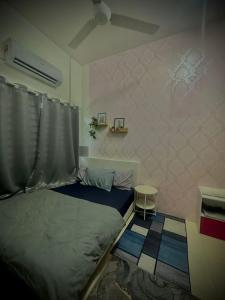 AD Homestay Gua Musang Terrace House with 3 room客房内的一张或多张床位