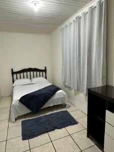 Casa Recanto Alegria客房内的一张或多张床位