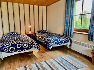 Laimjala Guesthouse with a Cozy Lounge and Terrace客房内的一张或多张床位