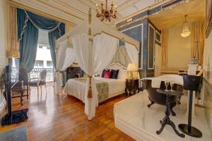 里斯本Palácio das Especiarias的一间卧室配有一张床和一个水槽