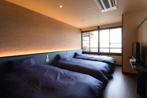 药师平茜宿日式旅馆客房内的一张或多张床位