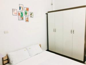 Simple & Cozy Hanoi Homestay客房内的一张或多张床位