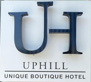 斯基亚索斯镇Uphill Unique Boutique Suites的读于乌基尔独特精品酒店的标志