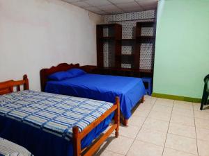 弗朗西斯科德奥雷利亚纳港Residencial RM的一间卧室,配有两张床