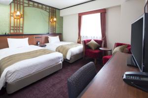 福尔克罗三里库酒店客房内的一张或多张床位