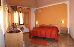 兰佩杜萨丽城酒店客房内的一张或多张床位