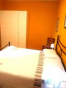 Appartamento Ortensia客房内的一张或多张床位